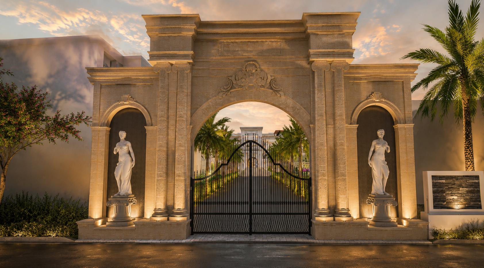 The stone entrance archway with statues in niches, lit at golden hour
